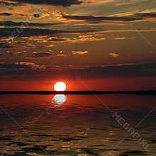 Above a bay exterminating sunset of a sun