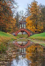 Famous Cross bridge in The Alexander Park during golden autumn