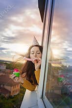 A young girl is celebrating her birthday alone
