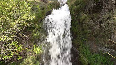 Crystal clear water flowing down the mountain