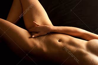 Wet body of a beautiful naked woman