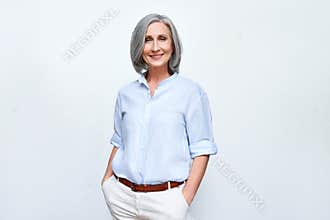 Smiling middle aged business woman standing isolated on white background.