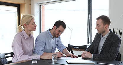 Couple sign mortgage contract receive keys express respect handshake broker