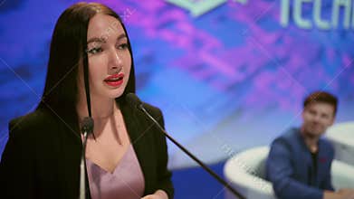 Speaker business woman speaking stage mic audience people. Educational speech.