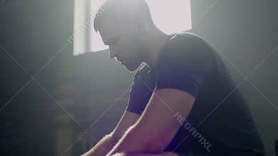 Handsome sportsman take rest after hard workout .