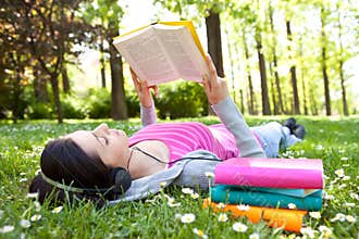 Relaxing in nature with book and music
