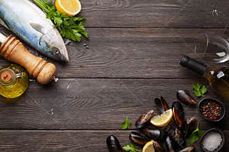Raw fish cooking. Seafood and wine