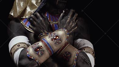 Long claws of Anubis, ancient egyptian clothes with jewelry, close up