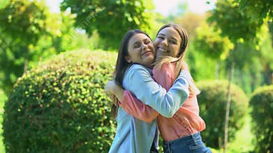 Best female friends tightly hugging, happy to see each other, sisters friendship