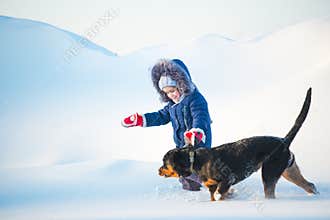 Happy active healthy little girl runs with her dog