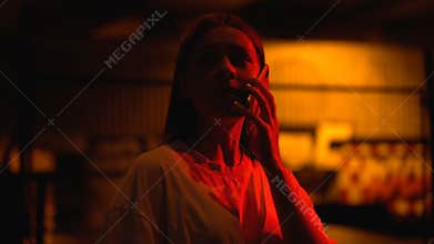 Shocked girl calling 911, attempted terrorist attack, fire, blinking red light