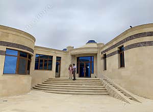 Gobustan, Azerbaijan, September, 11, 2019. People are near the museum building in the Gobustan state historical and art reserve