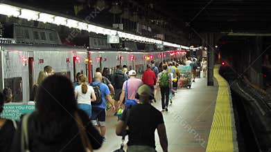 New York, NY, USA. Grand Central Station. Many people walking to the departing train