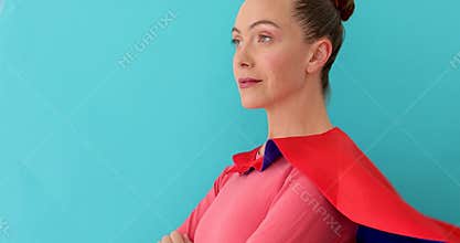 Superwoman smiling and looking at camera