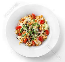 Caesar salad with lettuce, tomatoes, sprouts, croutons and sauce in plate on isolated white background. Healthy food, vegetarian