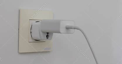 Plugging multiple power plugs into wall outlet