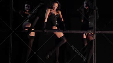Burlesque-style girls dancing in a club