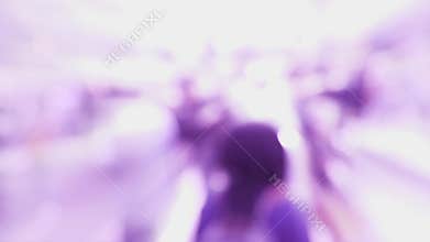 Busy city intersection with silhouettes of people walking