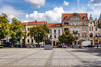 Market square with old tenement houses in Chelmno