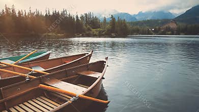 Anchored boat on mountain summer lake close up