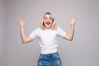 Amazed lovely woman covering mouth with hand