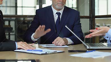 Employees quarreling about business project, boss bangs on table stops conflict