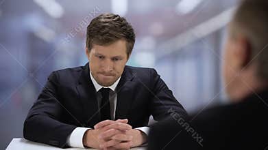 Company HR manager watching through young man resume, job interview failure
