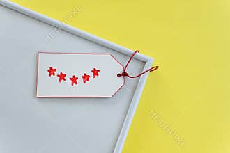 Five-star review on a label. Feedback concept