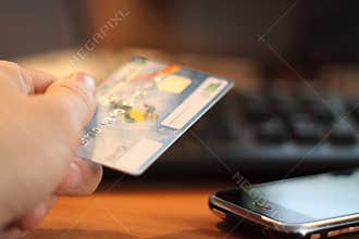 Hand with credit card