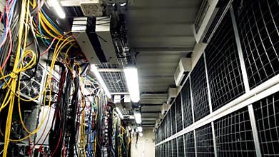 Inside room with data centers and cables. Stock footage. Room with data centers, cables and solar panels to absorb
