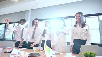 A group of business people are happy to throw the work document