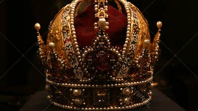 Real old vintage antique royal crown for official coronations, decorated with gold, diamonds, rubies, sapphires and
