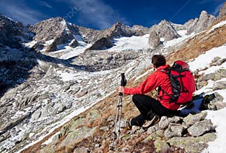 Hiker observing a high mountain panorama