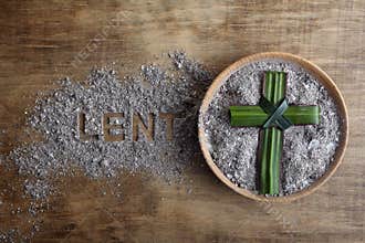 Lent word written in ash, dust as fast and abstinence period concept. Top view