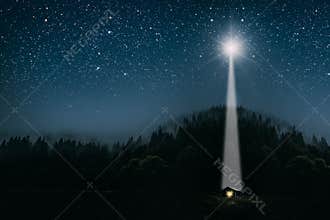 The moon shines over the manger of christmas of Jesus Christ