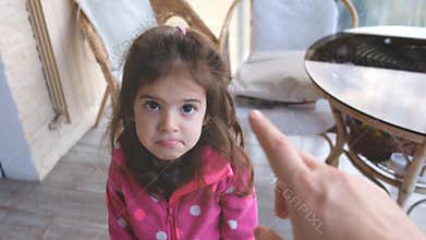 Parent hand yelling blaming and scolding child reproaching baby girl daughter