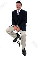 Attractive Businessman Sitting On Stool