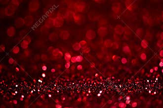 Abstract blur red glitter background card for Valentine`s day, christmas and wedding celebration. Love bokeh sparkle confetti
