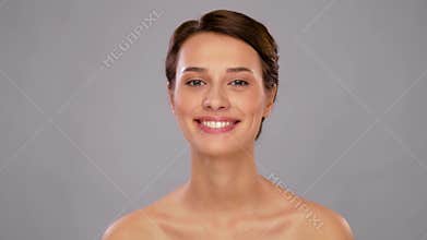 Beautiful smiling young woman with bare shoulder