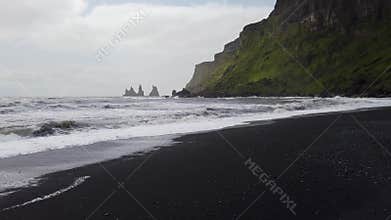 The black sand beach of Reynisfjara in the southern coast of Vik, Iceland.