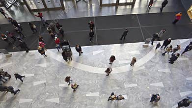 Crowd of people in a main hall of a shopping mall, top view