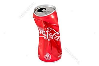 KIEV, UKRAINE - 25 June 2019: 330ml Coca cola crumpled can isolated on white background.