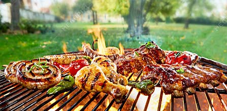 Assorted of mixed meats on a BBQ grill