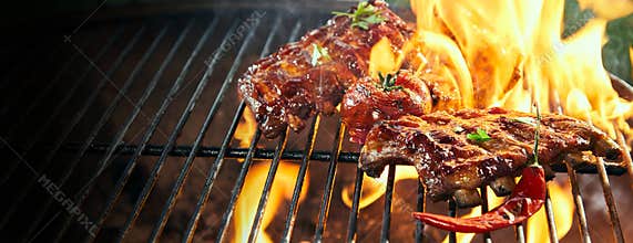 Marinated spicy pork ribs grilling on a bbq