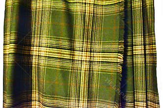 Tartan kilt by Mairi Macintyre of Scotland in green, cream, ochre