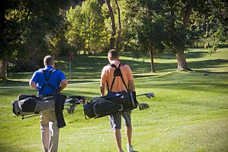 Golfers walking on the Golf Course