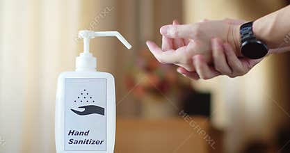 Man using hand sanitizer to clean his hands