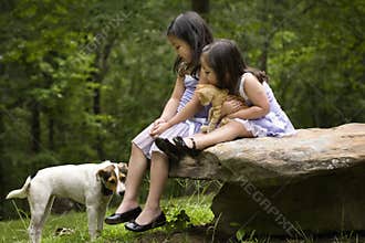 Asian sisters with their pets