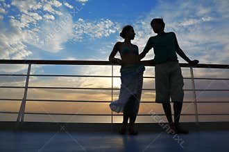 Man and woman on deck of cruise ship.