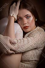 Woman with blue eyes on leather couch